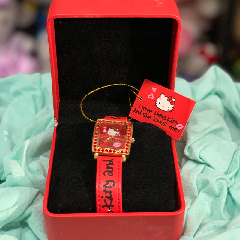 reloj de Hello Kitty con caja roja