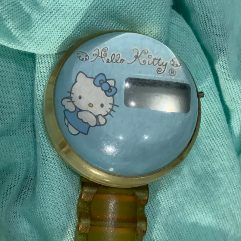 reloj de Hello Kitty cajita sonrics